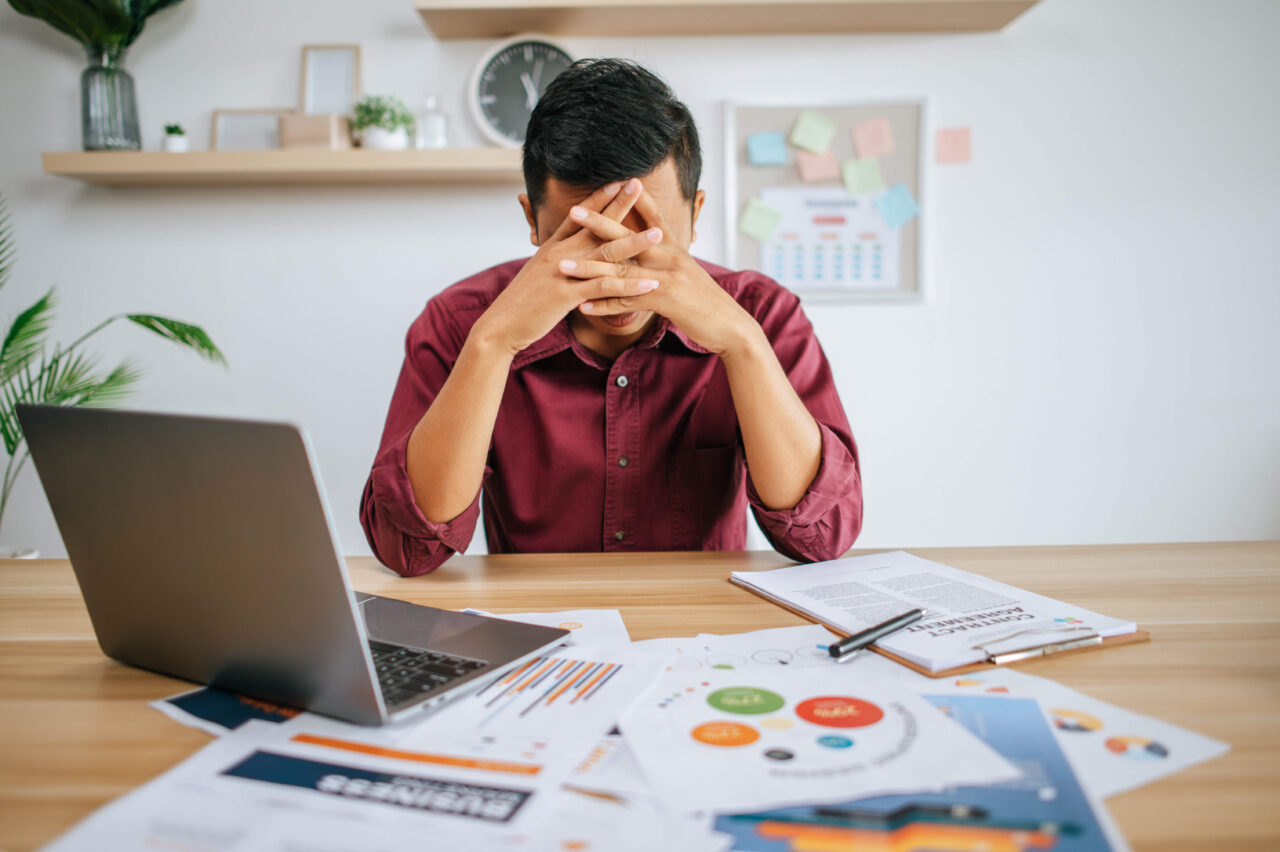 man-working-with-laptop-paperwor-1280x852.jpg