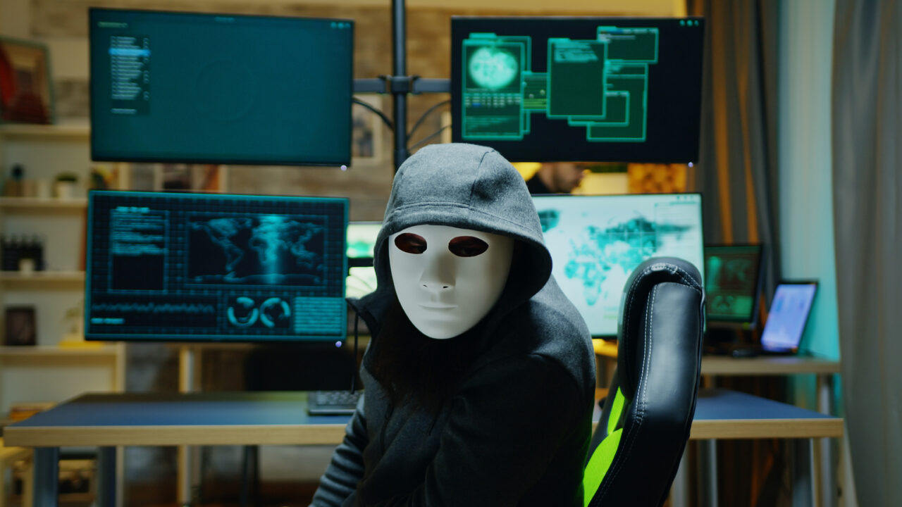 masked-hacker-wearing-hoodie-hide-his-identity-internet-criminal-1280x720.jpg