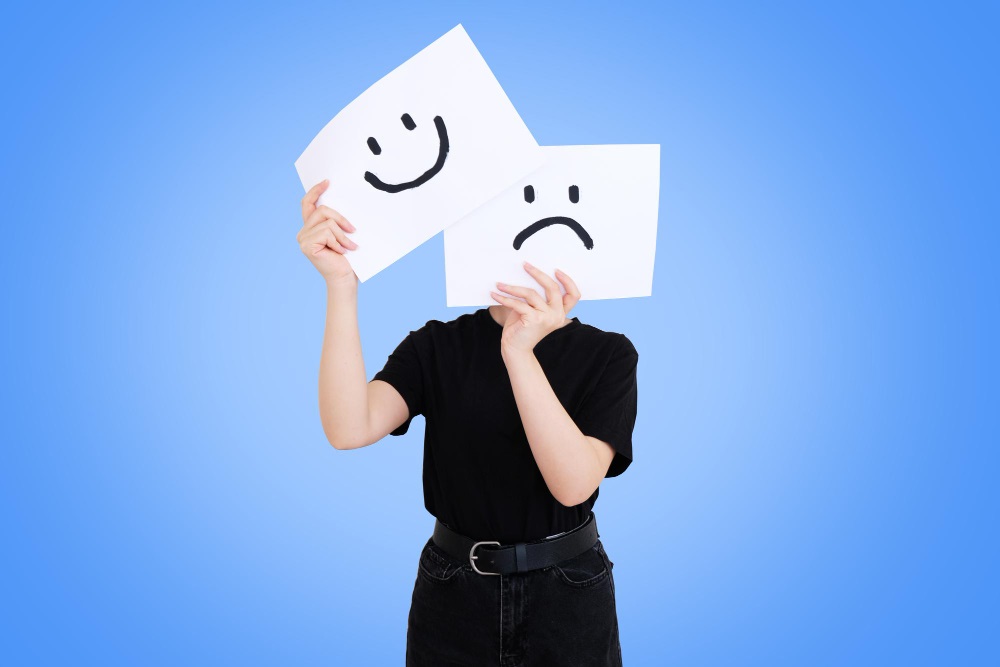 woman-holding-paper-with-smiley-sad-face-her-face-instant-psychological-change.jpg