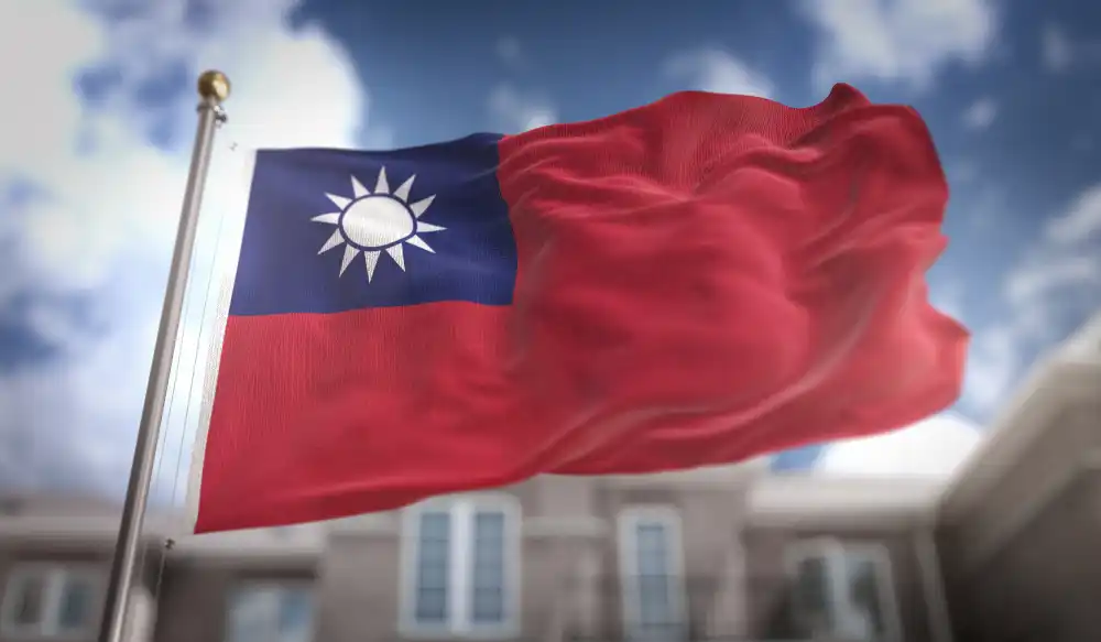 taiwan-flag-3d-rendering-blue-sky-building-background.webp